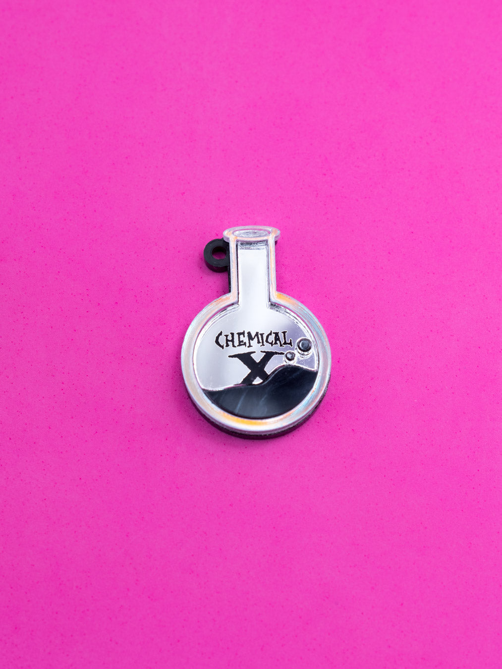 Charms/pendientes de metacrilato inspirados la sustancia X que creó a las Supernenas. Con espejo iridiscente.