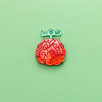 Pendientes inspirados en tu anime favorito, Nueces de belcebu o frutas del diablo hechas de metacrilato de diferentes colores, en este caso naranja aguas y espejo verde. Mera mera no mi