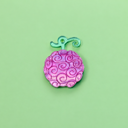 Pendientes inspirados en tu anime favorito, Nueces de belcebu o frutas del diablo hechas de metacrilato de diferentes colores, en este caso morado aguas y espejo verde. Gomu gomu no mi